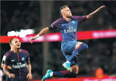  ?? BENOIT TESSIER / REUTERS ?? Neymar jumps for joy after netting his second goal of the match for Paris Saint-Germain in its 6-2 Ligue 1 thumping of Toulouse at Parc des Princes in Paris, France, on Sunday.