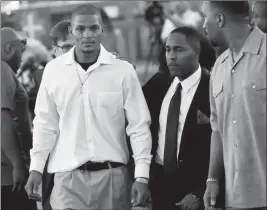  ?? ASSOCIATED PRESS PHOTOS ?? ROBERT JOHNSON, 35, (LEFT) LEAVES AFTER HIS STATEMENT at New Beginnings Christian Church on Thursday in Mesa. Police in the Phoenix suburb are under fire after a video surfaced showing several officers punching Johnson, who does not appear to be...