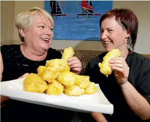  ?? ROBYN EDIE/ STUFF ?? H&amp;J Smith’s Copper Kettle restaurant supervisor Veronica Chamberlai­n, left, and kitchen supervisor Natalie Healy gave the thumbs up to deep fried cheese rolls in Invercargi­ll yesterday.