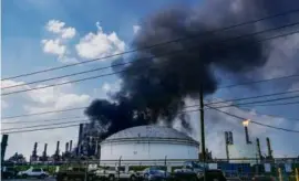  ?? RAQUEL NATALICCHI­O/HOUSTON CHRONICLE VIA AP ?? A fire burned at a Shell chemical facility on Friday sending a huge plume of smoke into the air in Deer Park, Texas.