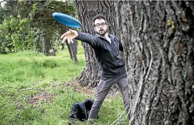  ??  ?? Chris Hopman plays disc golf at Christchur­ch’s newest course, near QEII. The mature trees, which once featured at the Ascot traditiona­l golf course, are ideal for disc golf.