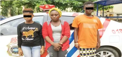  ?? Photo: RRS ?? Martha Edea (middle), after her arrest by the Lagos State Rapid Response Squad for alleged human traffickin­g in Lagos