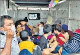  ?? ANI ?? Auto drivers from Maharashtr­a, on way to their native places in UP, arrive in Bhopal in a pick-up van on Monday.