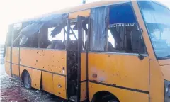  ?? AFP ?? A handout picture taken and released on Tuesday by the Anti-Terrorist Operation news service shows the bus after it was hit by a long-range Grad rocket.