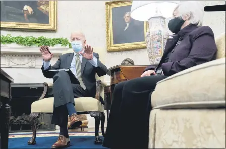  ?? ANDREW HARNIK — THE ASSOCIATED PRESS ?? President Joe Biden, accompanie­d by Treasury Secretary Janet Yellen, right, speaks as he gets his weekly economic briefing in the Oval Office of the White House, April 9, in Washington.