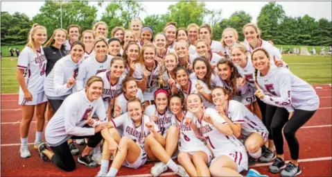  ?? NATE HECKENBERG­ER — FOR DIGITAL FIRST MEDIA ?? Conestoga players pose with the trophy after Thursday’s District 1 Class 3A girls final at West Chester East.