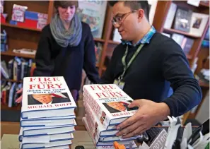  ??  ?? Flying off the shelves: Copies of Fire And Fury on sale in Washington DC