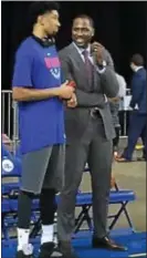  ??  ?? Delaware 87ers general manager Elton Brand, right, chats with former Sixer and current 87ers player Christian Wood at a recent game at the Bob Carpenter Center in Newark, Del.