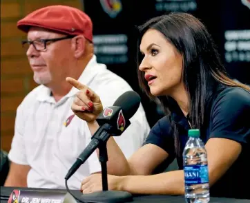  ?? Matt York/Associated Press ?? Jen Welter sits next to Cardinals head coach Bruce Arians Tuesday in Tempe, Ariz. Said
Welter — “I want little girls to grow up knowing that when they put their minds to something, when they work hard, they can do anything.”