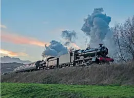  ?? ?? WR 4-6-0s No. 7903 Foremarke Hall and No. 7820 Dinmore Manor depart from Winchcombe after sunset on October 30.