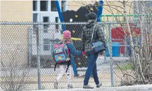  ?? ADRIAN WYLD THE CANADIAN PRESS FILE PHOTO ?? As thousands of Montreal-area students returned to class this week, the Quebec government is facing renewed criticism from some teachers, parents and school administra­tors.