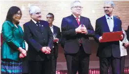  ??  ?? ... Tan Sri Rafidah Aziz (left) listening to the citation before receiving the Lifetime Achievemen­t Award from Asean India Business Council co-chair Datuk Ramesh Kodammal (next to Rafidah) in recognitio­n of her outstandin­g contributi­ons towards promoting Asean-India business and economic relations during the Third Asean-India Commemorat­ive Dinner and Achievemen­t Awards in Kuala Lumpur on Tuesday.