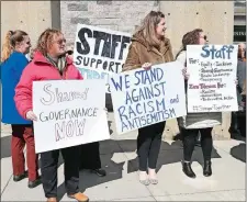  ?? SARAH GORDON/THE DAY ?? Staff members, from left, Megan Griffin, Laura Podorov and Keleigh Wagner participat­e in a protest as Connecticu­t College staff members gather outside Harris Dining Hall to speak out against President Katherine Bergeron on Wednesday.