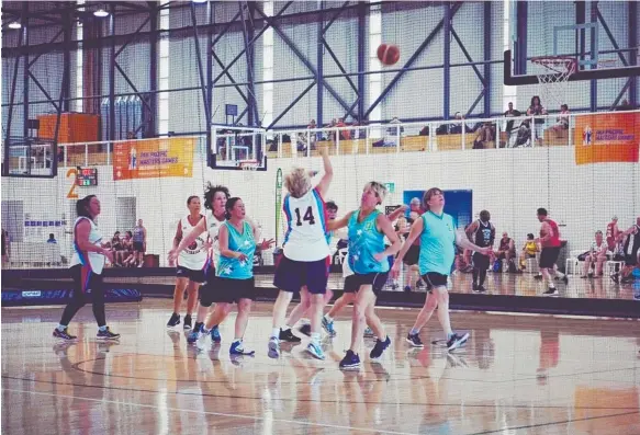  ??  ?? Olympic champion Glynis Nunn (second from right) in action for Gold Coast basketball team Shooting Stars in the 55-plus division.