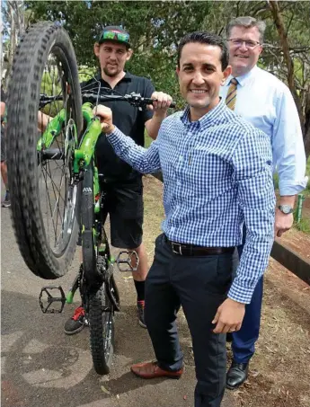  ?? Photo: Tom Gillespie ?? BIKE BUCKS: Toowoomba Mountain Bike Club vice-president Mitchell Thompson (left), Opposition tourism spokesman David Crisafulli (centre) and Toowoomba North MP Trevor Watts want to see the region’s mountain bike trails doubled as part of a new plan.