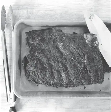  ?? Associated Press photo ?? This photo shows barbecue pork ribs in Amagansett, N.Y.