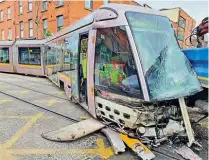  ??  ?? The damaged front end of LUAS tram No. 3001 is buried in the side of the lorry at the Queen Street/Benburb Street junction on March 30. The extent of the derailment is apparent.
