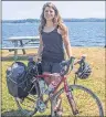  ?? CHRONICLE HERALD PHOTO ?? Anne Thomas placed the front wheel of her bike into the Atlantic Ocean on a Halifax beach Friday, marking the end of a 6,200-kilometre odyssey across Canada.