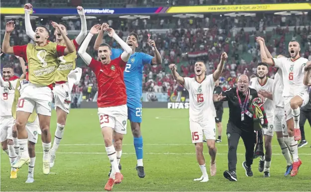  ?? ?? ↑ Morocco players celebrate after beating Belgium 2-0 in their World Cup Group F match at the Al Thumama Stadium, Doha, Qatar