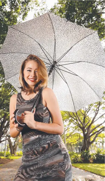  ?? Pictures: JOSH WONING ?? CO-ORDINATED: Model Cara McIlveen, wearing designs from Wild Sugar by Sajeela, shows how you can match your outfits with your brolly for a stunning wet season look.