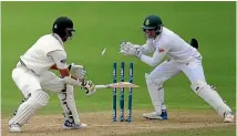  ?? PHOTO: PHOTOSPORT. ?? Proteas wicketkeep­er Quinton de Kock, shown here making a swift stumping of New Zealand opener Jeet Raval in the second test at Wellington, is a doubtful starter for the third match at Hamilton.