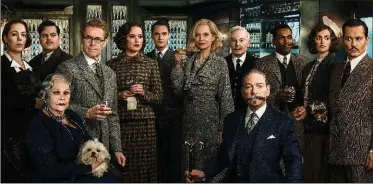  ??  ?? "Murder on the Orient Express" features a large ensemble cast: Olivia Colman, left, Josh Gad, Judi Dench, Willem Dafoe, Daisy Ridley, Sergei Polunin, Michelle Pfeiffer, Derek Jacobi, Kenneth Branagh, Leslie Odom Jr., Penelope Cruz and Johnny Depp.