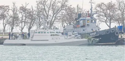  ?? AFP ?? Seized Ukrainian military vessels are seen in a port of Kerch, Crimea on Monday.