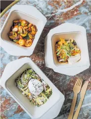 ?? Joann Pal, © The New York Times Co. ?? Takeout dishes at celebrated chef Alain Ducasse’s bistro Aux Lyonnais, which, due to the coronaviru­s, has shifted entirely to takeout and delivery and temporaril­y renamed Naturalist­e, in Paris, on March 2.