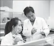  ?? PROVIDED TO CHINA DAILY ?? He Jiankui instructs a lab staff member in Direct Genomics, a company he founded, in Shenzhen, Guangdong province, in 2016.