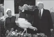  ?? OLIVIER DOULIERY/ABACA PRESS ?? President Donald Trump pardons Peas from South Dakota at the National Thanksgivi­ng Turkey pardoning ceremony in the Rose Garden of the White House on Tuesday in Washington, D.C.