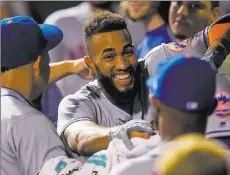  ?? Bill Streicher ?? USA Today Amed Rosario is mobbed in the Mets’ dugout Friday night after hitting his first major league home run, a go-ahead shot leading off the ninth inning of New York’s 7-6 victory over the Phillies at Citizens Bank Park.