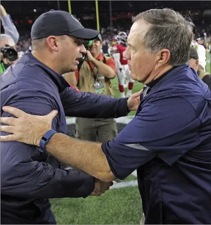  ?? HERALD STAFF PHOTO BY MATT STONE ?? Houston Texans head coach Bill O’brien, left, and New England Patriots head coach Bill Belichick shake hands after the Patriots beat the Texans, 27-6, in 2015. Rival teams are praising the Patriots for their coaching moves, including bringing back O’brien.