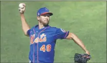  ?? KATHY WILLENS ?? New York Mets starting pitcher Jacob deGrom winds up while delivering during a simulated baseball game, part of the Mets summer training camp workout, at Citi Field in New York. Pete Alonso at the plate. Jacob deGrom on the mound. And a healthy Yoenis Céspedes pegged convenient­ly for designated hitter. There’s no question the New York Mets have reasons to believe this pandemic-shortened season is perfect for them — even without injured starter Noah Syndergaar­d. All they need to do is pick right up where they left off last year.