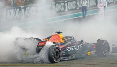  ?? Picture: AFP ?? SHOWING OFF A BIT. Red Bull’s Dutch driver Max Verstappen does a burnout as he celebrates his victory at the Abu Dhabi Formula One Grand Prix at the Yas Marina Circuit yesterday.