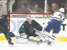  ?? Tony Avelar / Associated Press ?? Toronto’s Kasperi Kapanen, who scored twice, fires a shot past Sharks goalie Martin Jones in the first period.