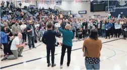  ?? ANDREW HARNIK/AP ?? Democratic presidenti­al candidate Elizabeth Warren speaks at a caucus at Roosevelt High School in Des Moines, Iowa, on Monday night.