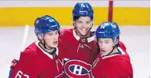  ?? PAUL CHIASSON/CP ?? Rookie Jesperi Kotkaniemi, centre, celebrates his goal on Monday with Artturi Lehkonen, left, and Charles Hudon.