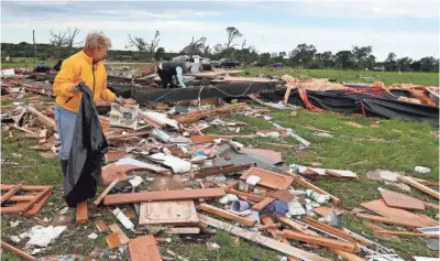  ?? LARRY W. SMITH, EPA ?? Residents pick through the wreckage of trailer homes Sunday near Canton, Texas, after a tornado struck.