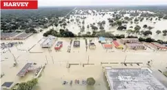  ?? AP/FILE ?? The August storm sent water from reservoirs flowing into neighborho­ods. HARVEY