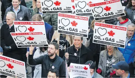  ?? PHOTOS: GAVIN YOUNG ?? Calgarians protest outside the Telus Convention Centre as federal Finance Minister Bill Morneau speaks at a luncheon inside.