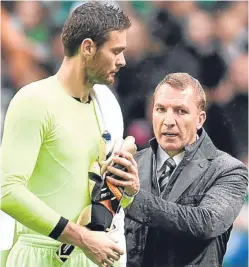  ?? Picture: SNS Group. ?? Celtic manager Brendan Rodgers has a word with Craig Gordon after the keeper played the second half of Saturday’s victory over Kilmarnock.