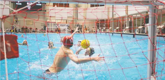  ?? KAYLE NEIS ?? Manitoba’s Drake Chopp lines up a shot during the Water Polo Saskatchew­an Winter Provincial­s Dec. 7 at Shaw Centre, which has helped attract high-profile events for the sport.