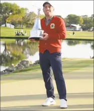  ?? Phelan M. Ebenhack / Associated Press ?? Francesco Molinari holds the trophy after winning the Arnold Palmer Invitation­al on Sunday.