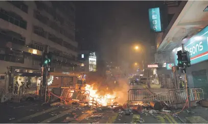  ?? Picture: AFP ?? VENTING THEIR FEELINGS. Protesters burn debris in the street during clashes with police following an earlier unsanction­ed protest march through Hong Kong yesterday.