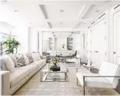  ?? COURTESY PHOTO ?? All white furniture and area rug create a fresh, modern look in this living room.