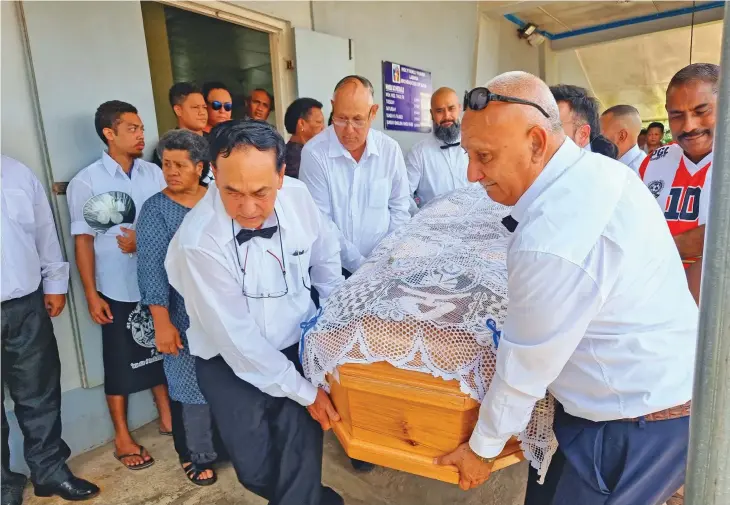  ?? Photo: ?? Front (left-right) Maxie Zoing, Simon Zoing and Rexie Zoing (back) carry the coffin of their older brother Jimmy Zoing after his Resurrecti­on Mass at the Holy Family Parish in Labasa on February 2, 2023. The Zoing brothers represente­d Labasa and the national football team during their prime. Sampras Anand