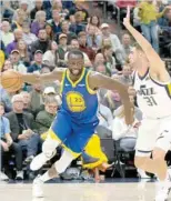  ?? — USA Today Sports ?? Golden State Warriors’ Draymond Green (23) dribbles the ball against Utah Jazz forward Georges Niang (31) at Vivint Smart Home Arena.