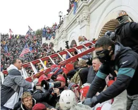  ?? /Reuters ?? Contesting the vote: Pro-Donald Trump protesters storm into the US Capitol during clashes with police in Washington on January 6 2021.