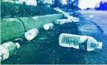  ?? ?? A broken case of water lays along the street near a water station in Flint, MI, February 2016