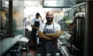  ??  ?? ABOVE: Executive chef Sujan Sarkar poses in Rooh’s kitchen.